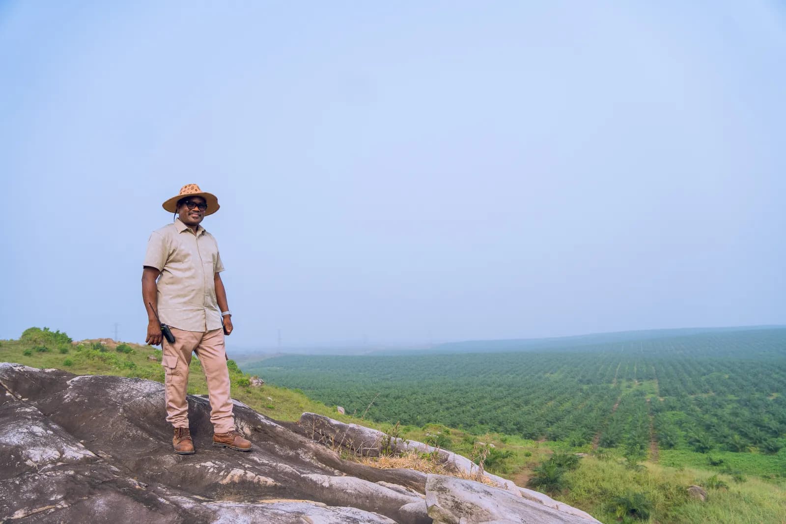 Dr. Emmanuel Abiodun Awelewa overlooking JB Farms oil palm plantation